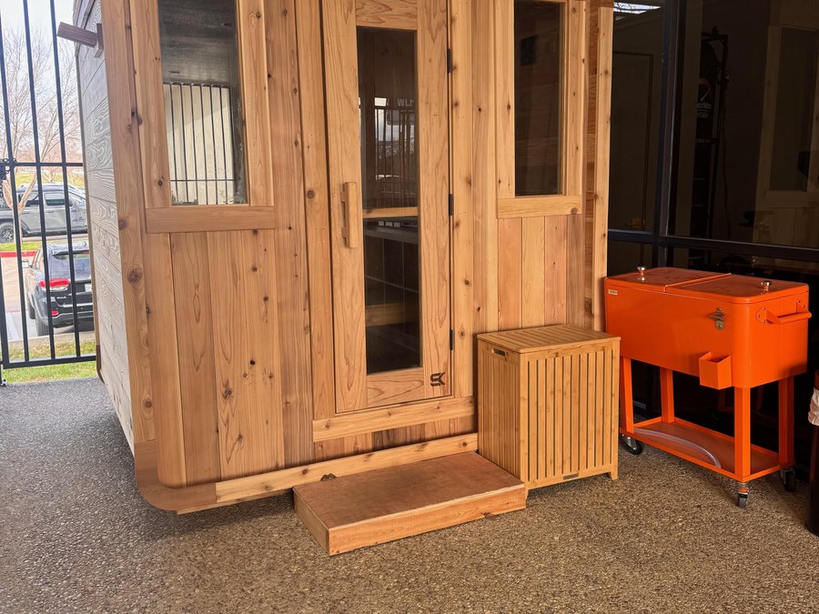 The cedar sauna at WLF Club, on the covered patio.