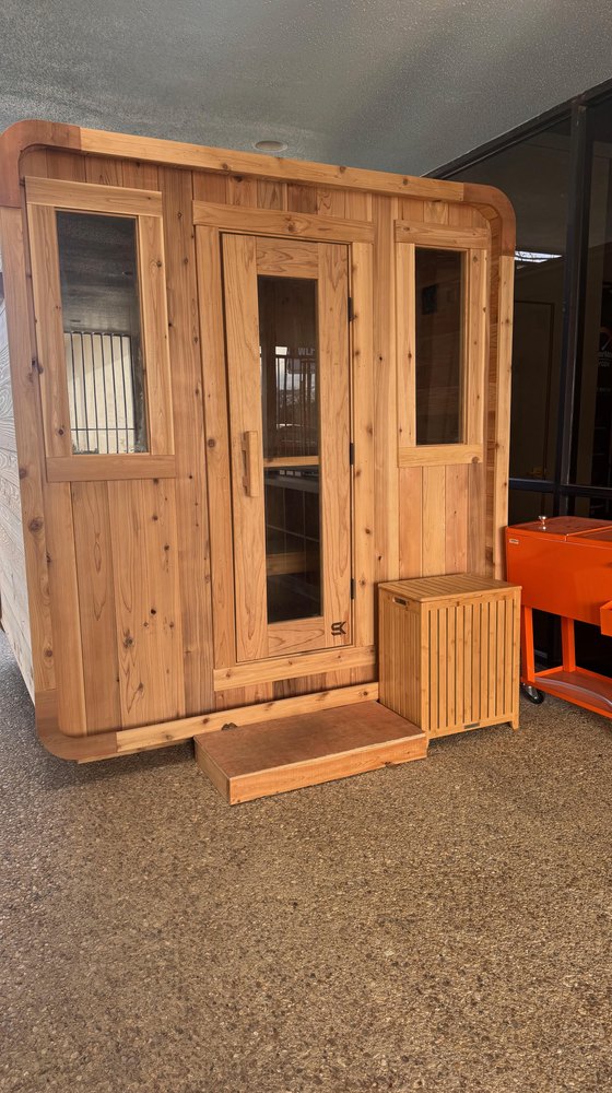 The cedar sauna at WLF Club, on the covered patio.