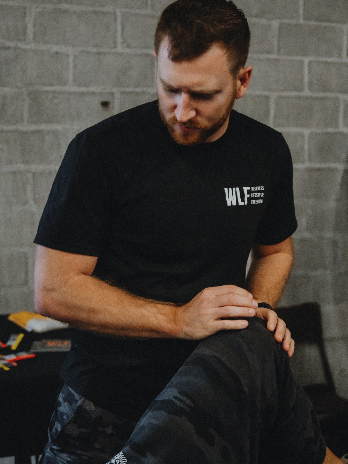 A WLF clinician working hands-on with a client's knee.